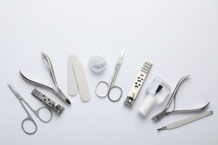 Set of different manicure tools on white background, flat layの写真素材