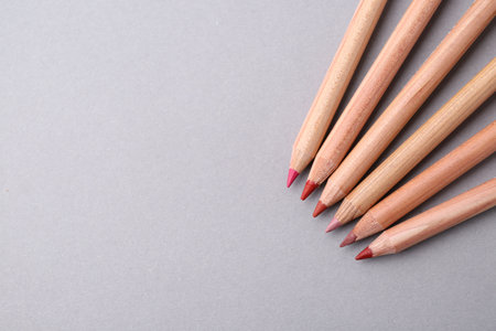 Many different pencils on light gray background, flat lay. Space for textの写真素材