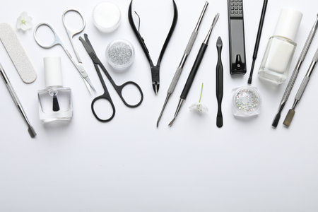 Set of different manicure tools on white background, flat layの写真素材