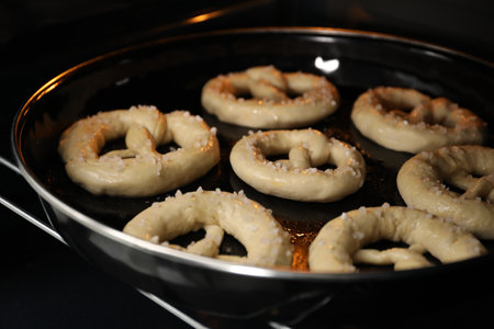 Baking dish with pretzels in oven, closeupの写真素材