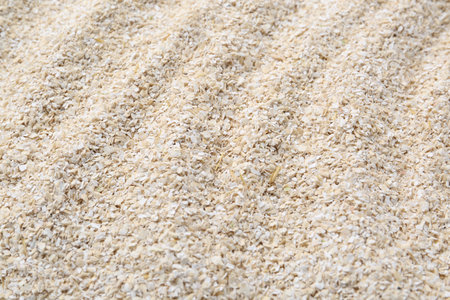 Superfood product. Oat powder as background, closeupの写真素材