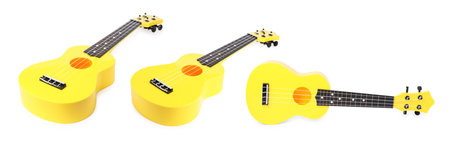 Yellow toy guitar on white background, collage. Child's musical instrumentの写真素材