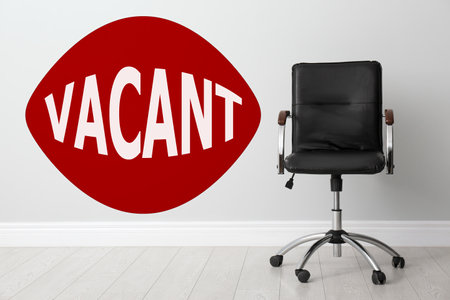 Empty office chair in room and word Vacantの写真素材