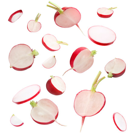 Fresh ripe radish pieces falling on white backgroundの写真素材