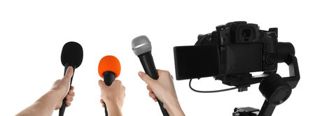 Journalists with microphones and video camera on white background, closeupの写真素材