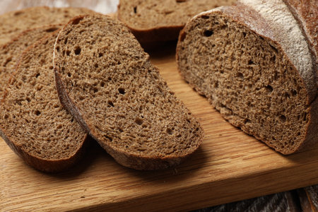 Pieces of fresh bread on table, closeup