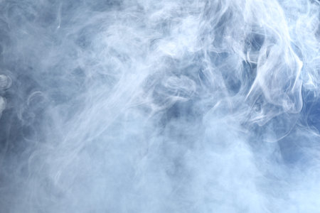 Beautiful smoke in lights on dark background