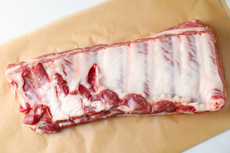 Raw pork ribs on white table, top viewの写真素材