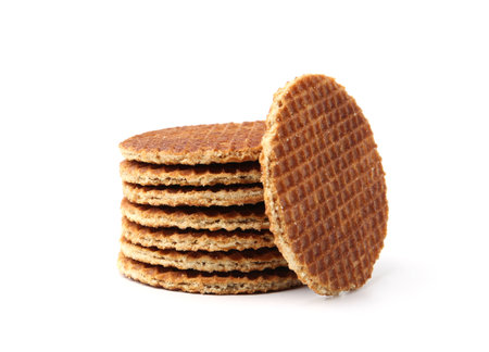 Stack of tasty round waffles isolated on whiteの写真素材