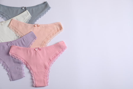 Women's underwear. Beautiful panties on white background, flat lay. Space for textの写真素材