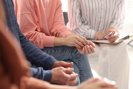 Group of people having psychotherapy session indoors, closeupの写真素材
