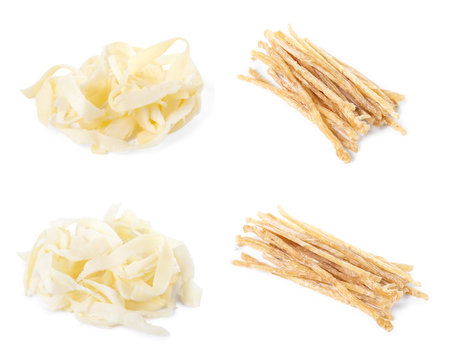 Dried shredded fish snack and squid isolated on whiteの写真素材