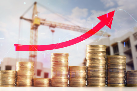 Rising prices. Unfinished building, coins and graphs, multiple exposureの写真素材