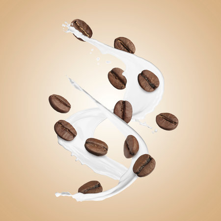 Aromatic coffee beans and splashes of fresh milk in air on beige backgroundの写真素材