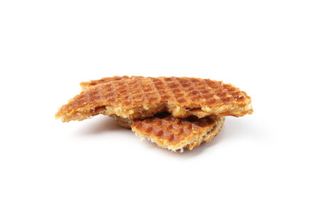 Pieces of tasty round waffle isolated on whiteの写真素材