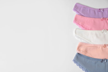 Women's underwear. Beautiful panties on white background, flat lay. Space for text