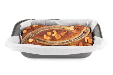 Delicious banana bread with nuts isolated on whiteの写真素材