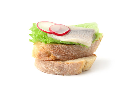 Tasty sandwich with herring, radish and lettuce on white backgroundの写真素材