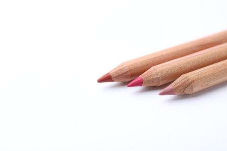 Many different lip pencils on white background, closeup. Space for textの写真素材