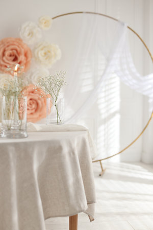 Stylish room with burning candle, flowers and other wedding decor. Interior designの写真素材