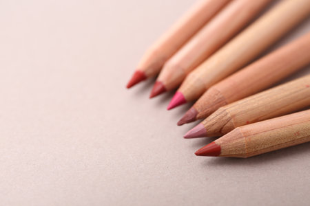 Many different lip pencils on light background, closeup. Space for textの写真素材
