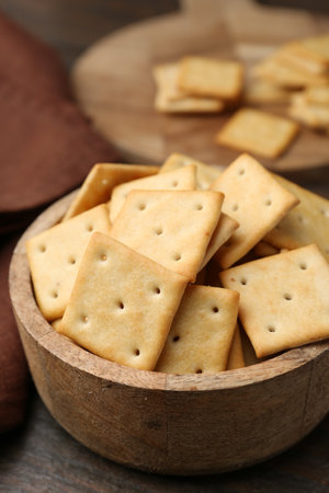 Tasty crackers on wooden table, closeupの写真素材