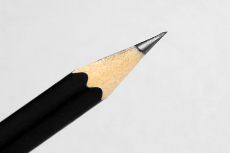 One sharp graphite pencil on light background, closeupの写真素材