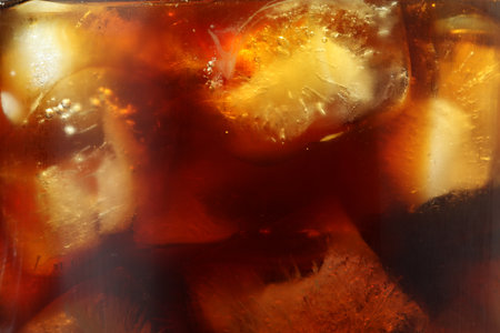 Refreshing coffee with ice cubes as background, closeupの写真素材