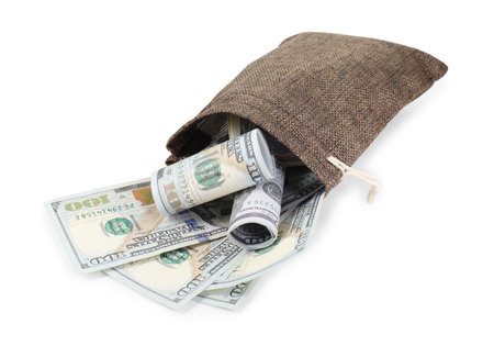 Money bag with dollar banknotes isolated on whiteの写真素材