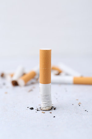 Cigarette butts on light background, selective focusの写真素材