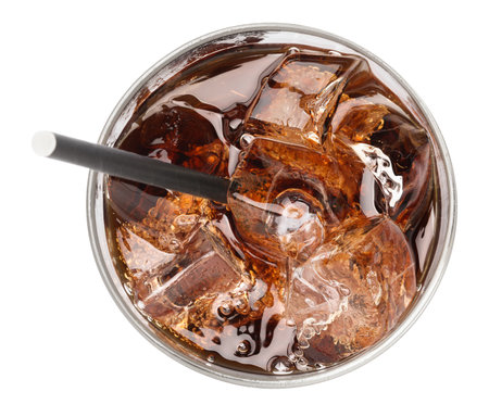 Refreshing cola with ice cubes and straw in glass isolated on white, top viewの写真素材