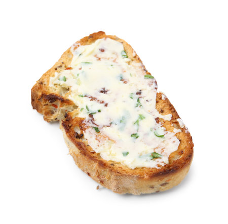 Tasty slice of bread with garlic, herbs and butter isolated on whiteの写真素材