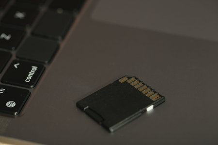 One SD memory card on laptop, closeup