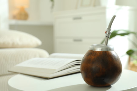 Traditional yerba mate tea on white table indoors