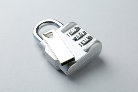 Flash drive and combination padlock on light background, closeupの写真素材