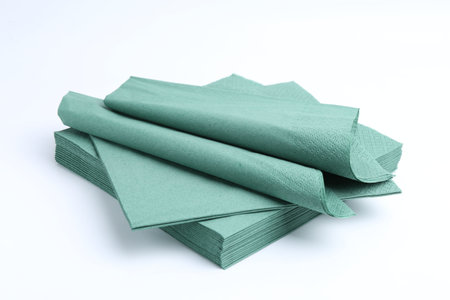Many green paper handkerchiefs isolated on whiteの写真素材