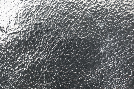 Crumpled aluminum foil as background, top viewの写真素材