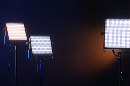 Professional lighting equipment on color background. Space for textの写真素材