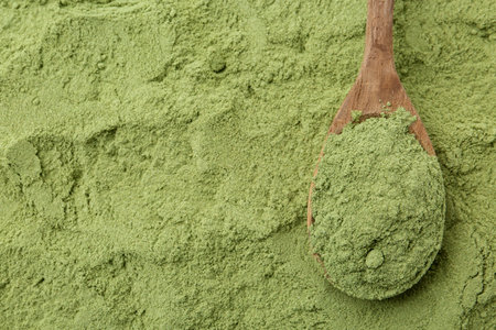 Superfood. Wheat grass powder and spoon, top viewの写真素材