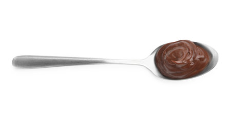 Tasty chocolate pudding in spoon isolated on white, top viewの写真素材
