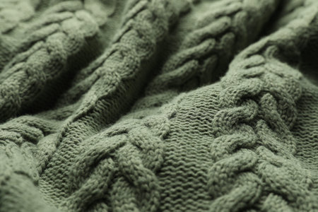 Knitted dark soft woolen fabric, closeup view