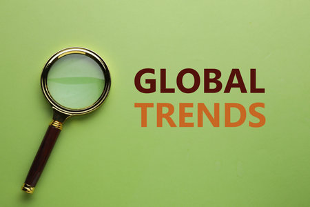 Magnifying glass on green background, top viewの写真素材