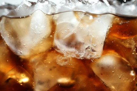 Refreshing cola with ice and bubbles, macro viewの写真素材