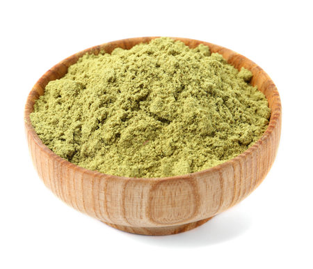 Pumpkin seeds powder in bowl isolated on whiteの写真素材