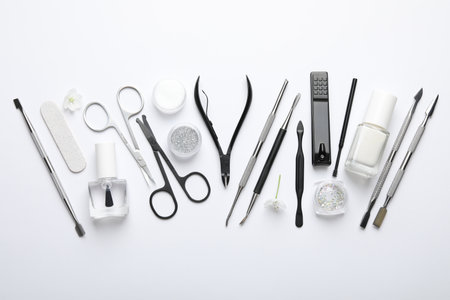 Set of different manicure tools on white background, flat layの写真素材