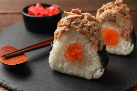 Tasty onigiri (Japanese rice balls) with tuna served on table, closeupの写真素材
