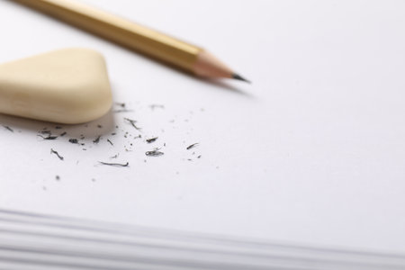 Eraser, pencil and scraps on paper, closeup. Space for textの写真素材