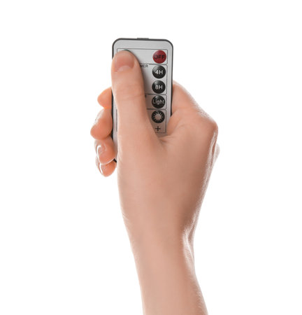 Woman with modern lighting remote control on white background, closeupの写真素材