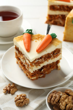 Delicious homemade carrot cake served on white wooden tableの写真素材