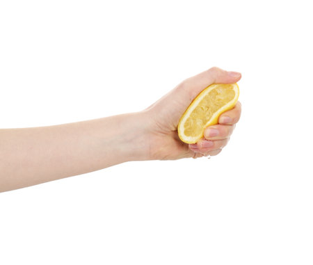 Woman squeezing lemon on white background, closeupの写真素材